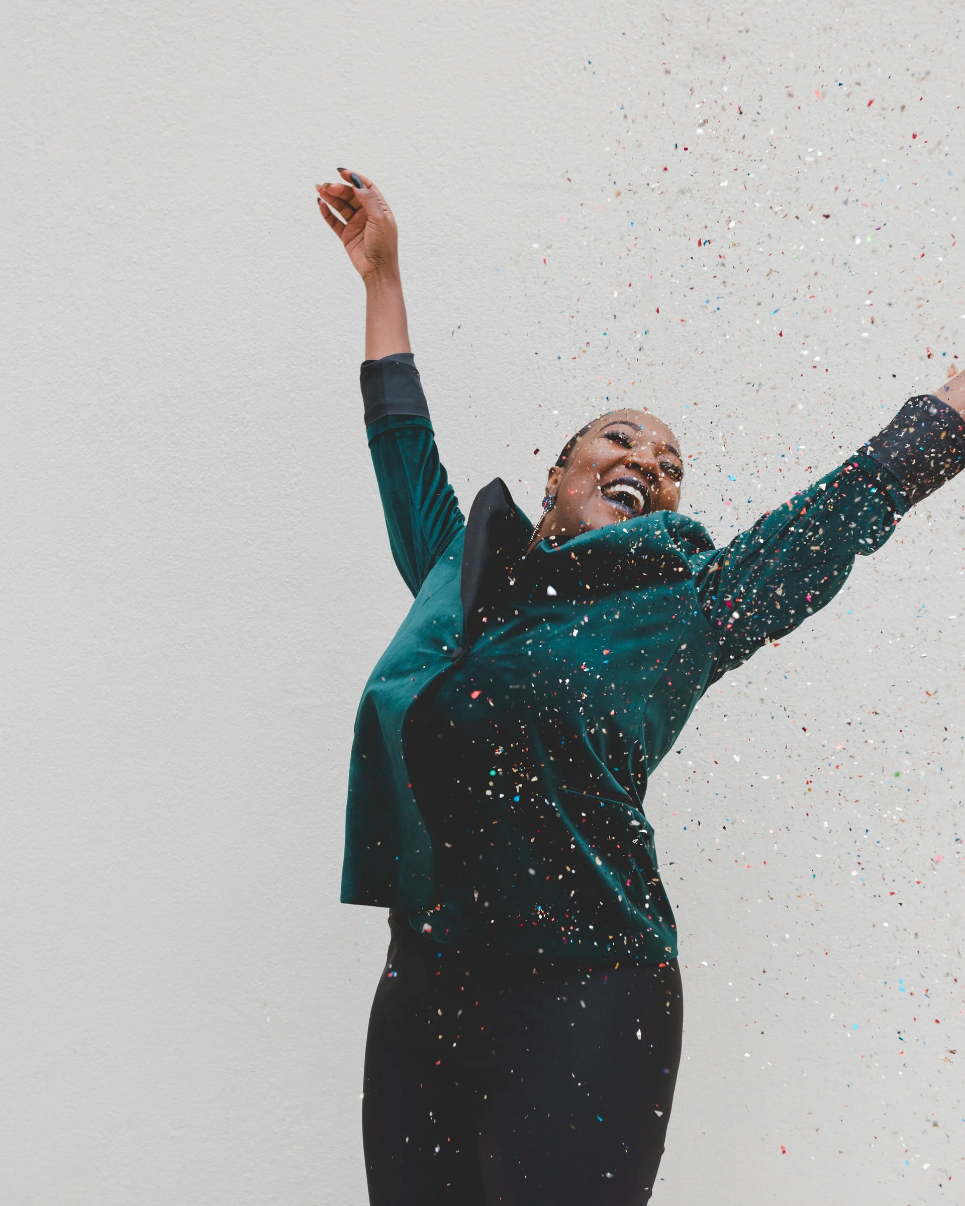 woman of color jumping for joy